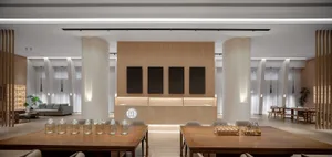 Modern hotel lobby featuring wooden accents and a minimalist design.