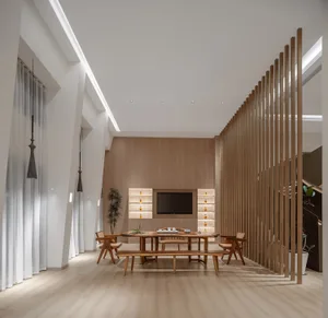 Modern minimalist living room with wood furniture and white walls.