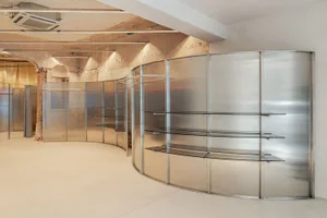 Modern retail storefront featuring glass and metal materials