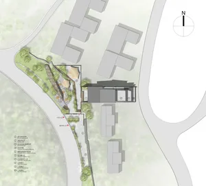 A technical 2D drawing of a building site with labels for various elements such as parking, terraces, and entrances.