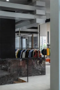 Modern clothing store with marble concrete and steel interior design