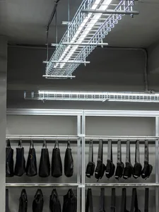Industrial hardware store with metal hooks hanging on the wall