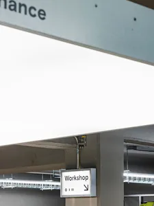 Interior design of an industrial-style workspace featuring modern lighting solutions.