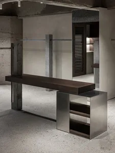 Modern industrial retail storefront featuring concrete, steel, and glass materials.