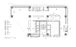 Modern office interior with glass-walled staircase and open-plan layout.