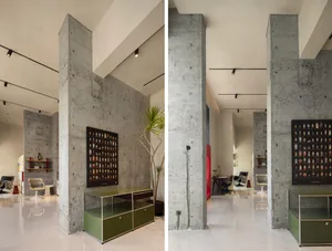 Modern office space featuring concrete columns and minimalist design elements.