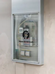 Industrial-style electrical cabinet with a sign that reads 'DANGER! Please do not touch.'
