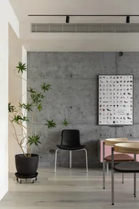 Industrial-style interior design featuring concrete and wooden elements.