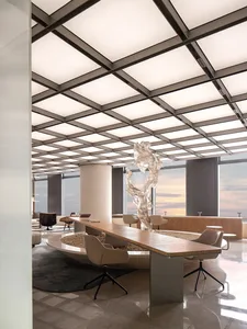 Modern minimalist office space featuring metal, glass, and concrete materials.