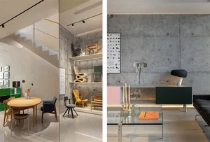 A modern living room featuring a concrete wall, minimalistic furniture, and a glass coffee table.