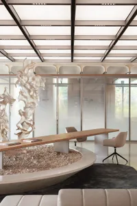 A modern office space with glass partitions and minimalist furniture.