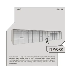 A modern office interior with glass walls and a minimalist design.