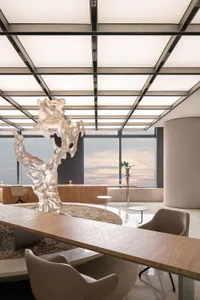 Modern office space featuring a metallic sculpture with a minimalist design.