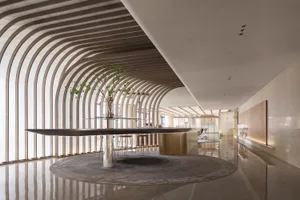 Modern retail space featuring metallic, glass, and stoneware elements.