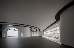 A modern lobby with a concrete floor and minimalist design.