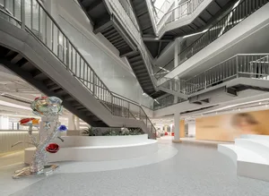 A modern office interior featuring glass, metal, and concrete materials.