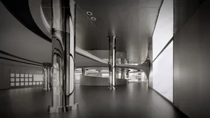 Modern office space with metallic columns and curved ceiling.