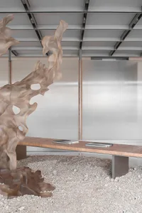 Minimalist modern office space featuring transparent glass and fiberglass elements.