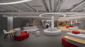 A modern office space featuring neutral-toned materials and comfortable seating arrangements.