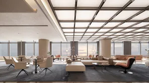 A spacious, modern hotel lobby featuring steel, leather, and glass materials.