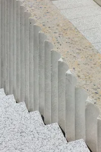 Modern stairs with concrete steps and granite railings