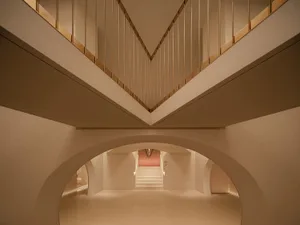 Concrete staircase intersection with minimalist design and clean lines.