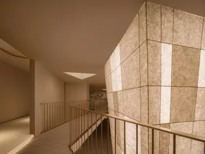 A modern interior space featuring textured paper walls, capturing contemporary design elements