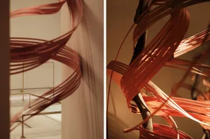 A modern interior design featuring a metal wrap around a structural element.