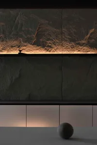 Modern residential interior with stone features and lighting