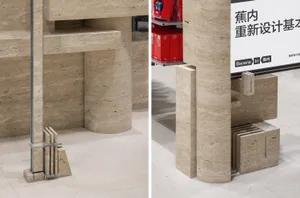 Industrial-style interior with stone columns and red boxes on shelves.