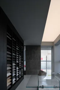 Modern minimalist office with concrete and glass elements showcasing sleek, contemporary design