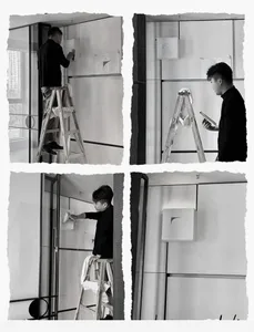 A person installing textured wall coverings on a wall.