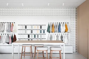 A display of various fabrics and materials in a modern retail setting