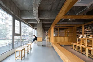 Modern library with glass, concrete, and wooden elements