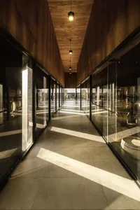 A modern interior with glass walls in a wine-tasting room.