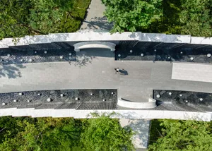 Aerial view of a modern architectural space featuring concrete and marble elements.