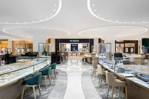 A modern retail jewelry store featuring marble and glass