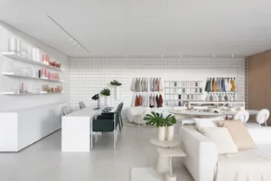 Modern showroom with concrete, wood, and glass materials