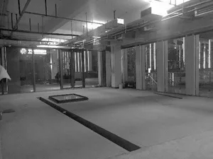 Modern office space with concrete, glass, and metal elements.