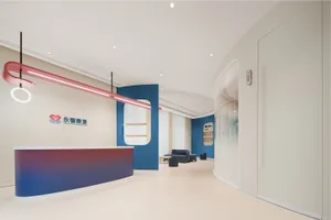 A modern commercial interior featuring a sleek, multi-colored reception desk with a contemporary design.