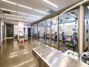 Modern, industrial medical center with glass walls and metallic surfaces