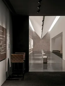 Modern, minimalist corridor made of concrete with sleek, clean lines.