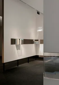 Modern interior design featuring materials like glass, wood, metal, and concrete.