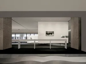 Modern minimalist exhibition space with concrete elements and clean lines.