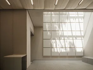 A modern office space featuring a glass ceiling