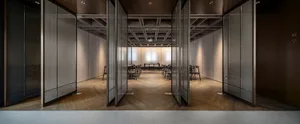 A modern office space featuring glass walls.