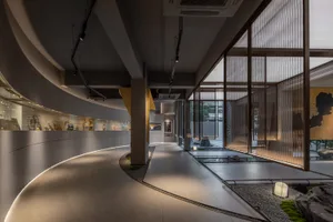 A modern commercial interior design featuring contemporary materials and sleek lines.