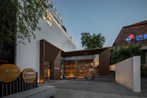 Modern storefront with a glass and concrete facade, contemporary design elements, commercial retail space