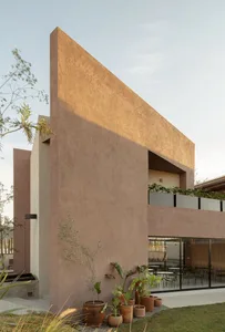 A modern residential interior featuring minimalistic design and concrete walls.