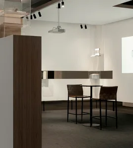 Modern coffee shop with a high-top counter and contemporary design elements.